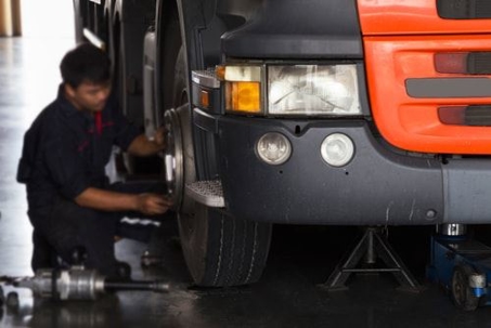Man fixing commercial truck tire