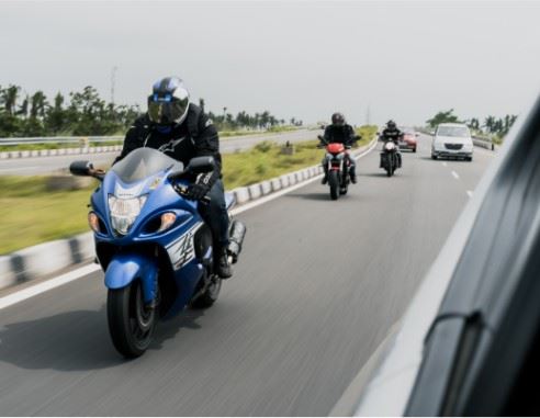 three motorcyclists riding on the highway